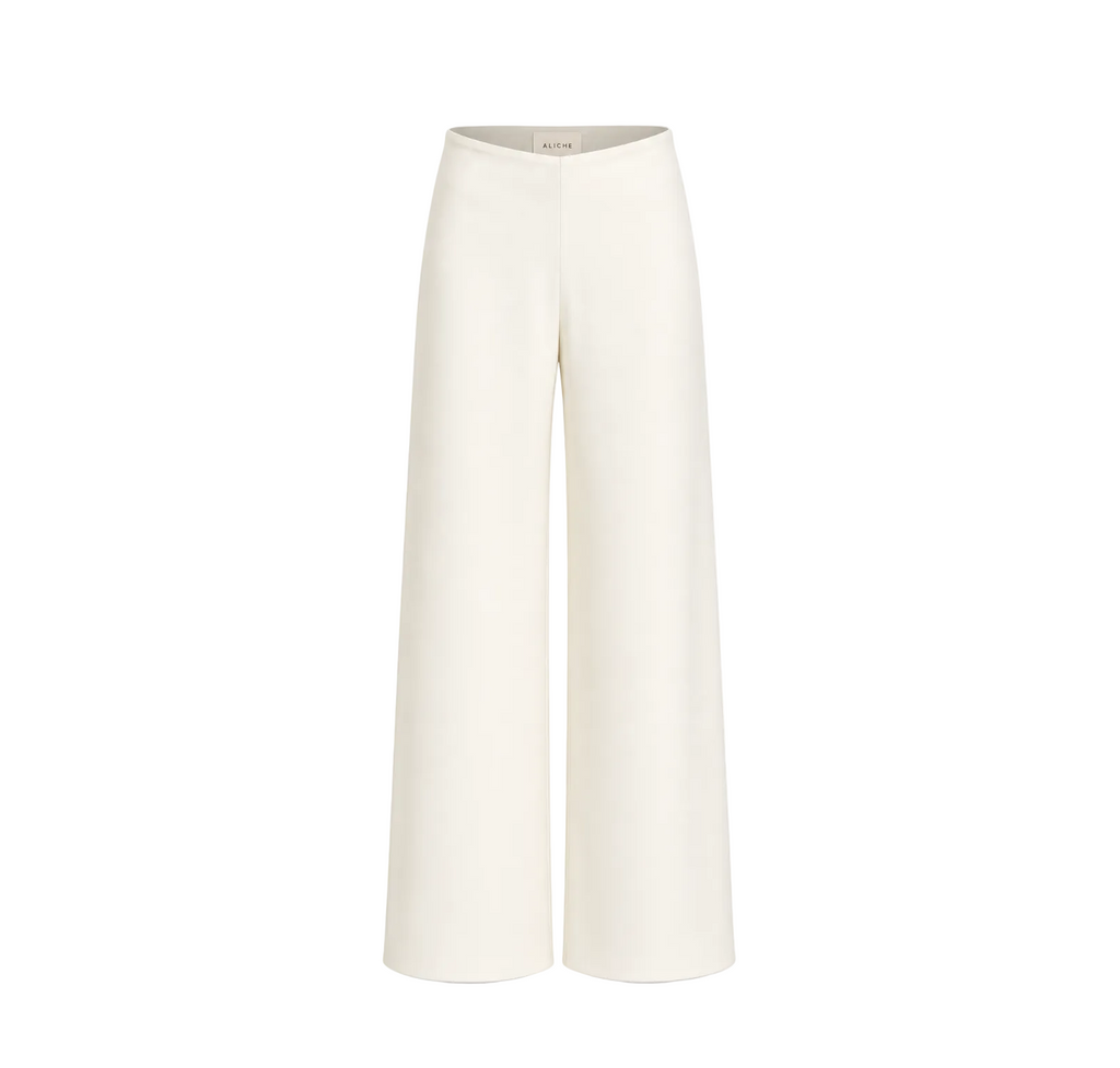 Front view of ivory high-waisted wide-leg trousers with a minimalist tailored silhouette on a light grey background.