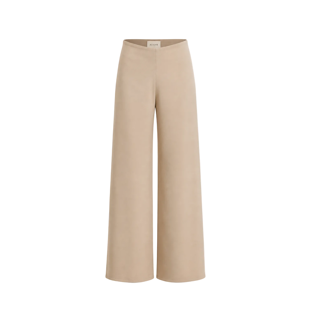 High-waisted sand wide-leg trousers with a minimalist tailored silhouette on a light grey background.